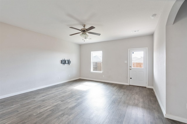 spare room featuring ceiling fan and dark hardwood / wood-style floors