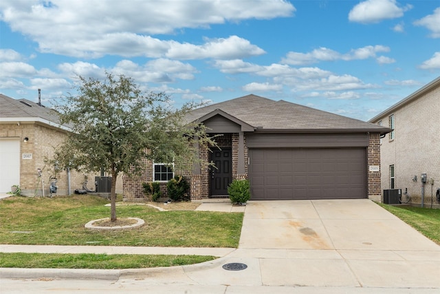 ranch-style house with central AC unit, a garage, and a front lawn