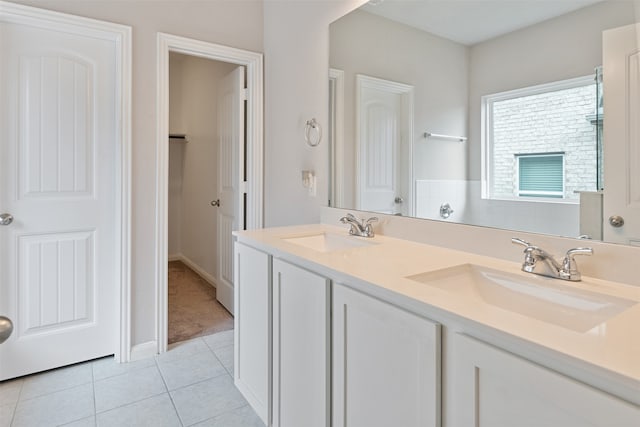 bathroom with tile patterned floors and vanity