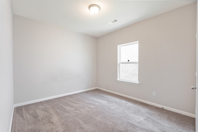 empty room with light colored carpet