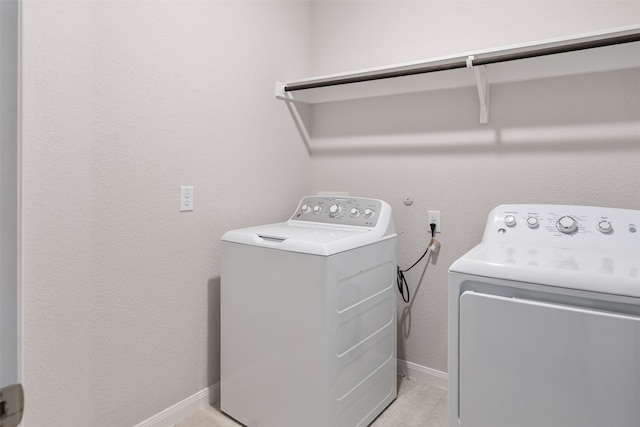 washroom with independent washer and dryer