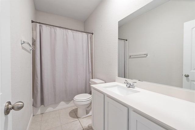 full bathroom with tile patterned flooring, shower / tub combo, vanity, and toilet