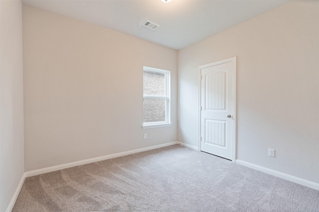 unfurnished room featuring carpet