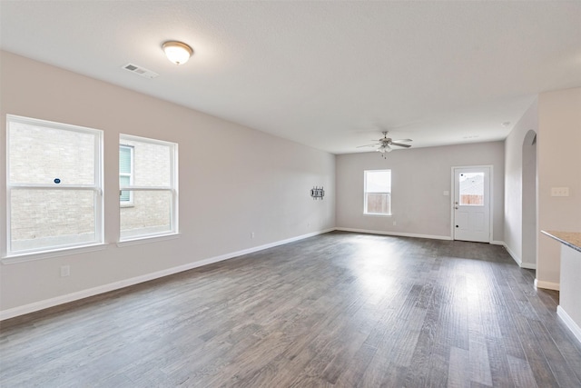 spare room featuring dark hardwood / wood-style floors and ceiling fan