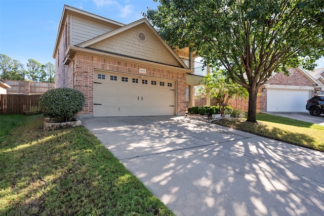 view of front facade featuring a front yard and a garage