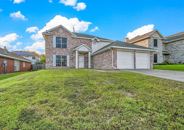 view of front property featuring a front yard and a garage