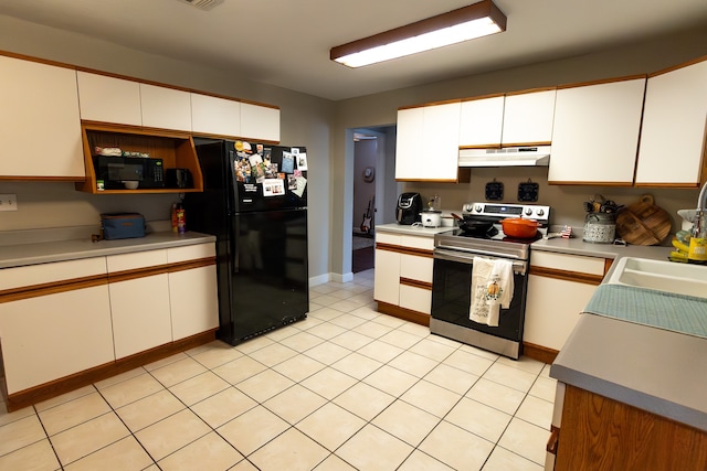 kitchen featuring black appliances and white cabinetry