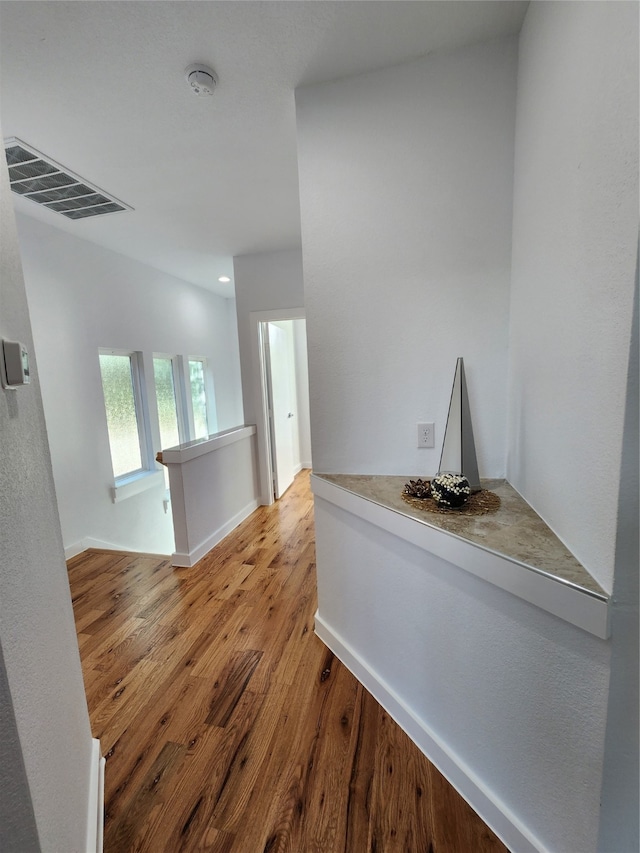 hallway featuring hardwood / wood-style flooring