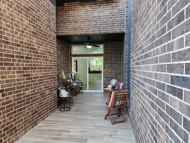 property entrance with ceiling fan