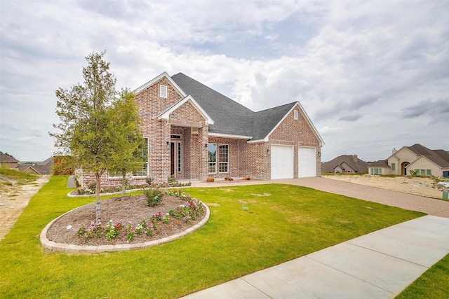 view of front of property with a front yard and a garage