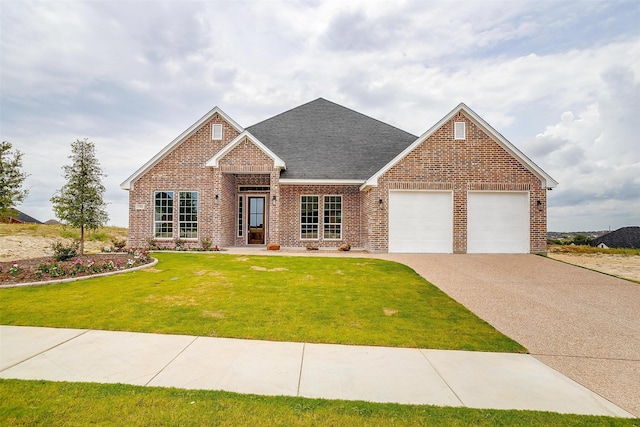 view of front of property featuring a garage and a front lawn