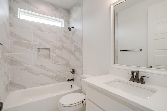 full bathroom featuring vanity, tiled shower / bath combo, and toilet