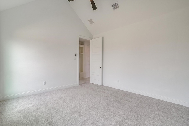 empty room with light carpet, high vaulted ceiling, and ceiling fan