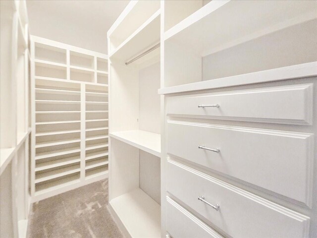 laundry area with hookup for a washing machine, hookup for an electric dryer, light tile patterned floors, and cabinets