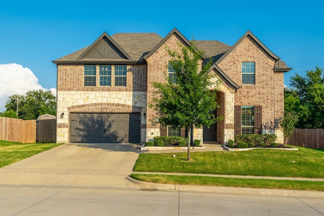 view of front facade featuring a garage and a front lawn