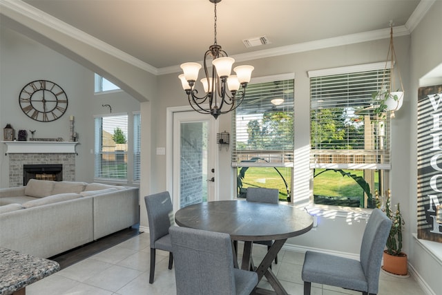 tiled dining space with ornamental molding and a notable chandelier