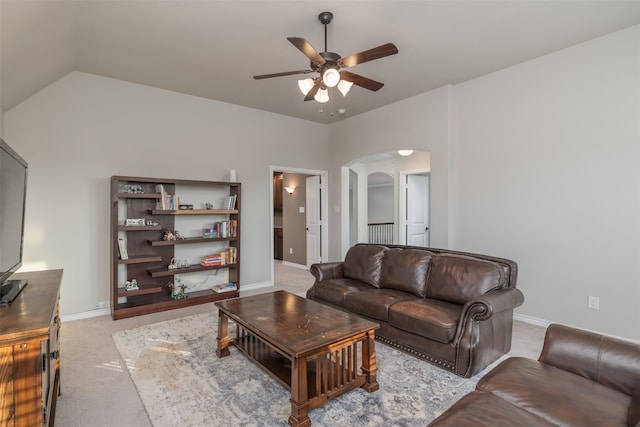 living room with light colored carpet, vaulted ceiling, and ceiling fan