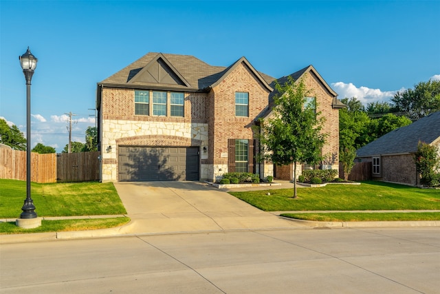 view of front of home with a front yard and a garage