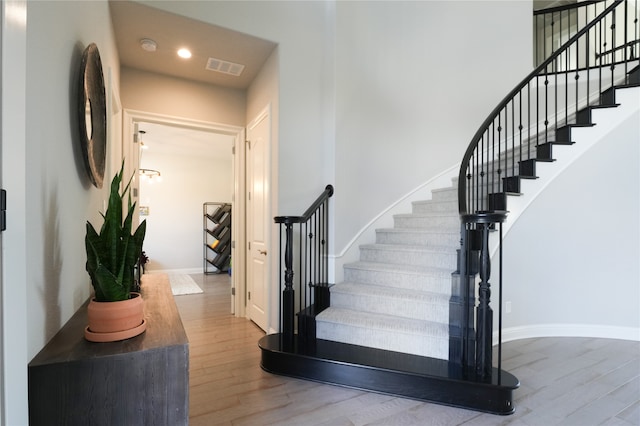 stairway featuring hardwood / wood-style flooring