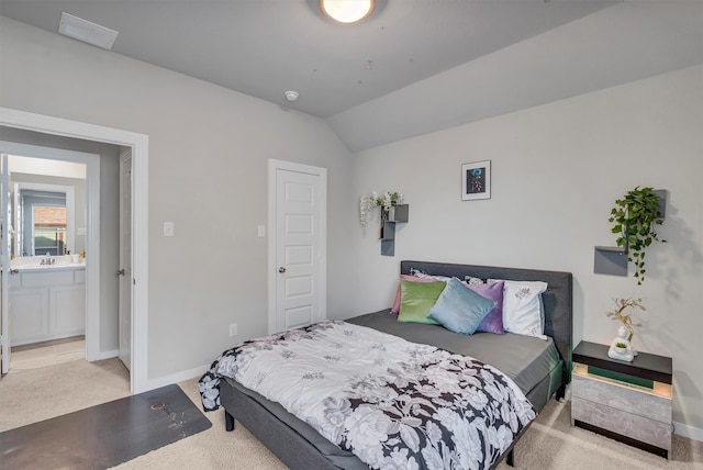 bedroom featuring lofted ceiling, light carpet, visible vents, and baseboards