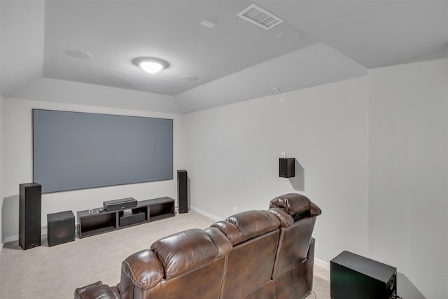 carpeted home theater featuring visible vents and baseboards