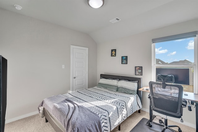 bedroom with light carpet, baseboards, visible vents, and vaulted ceiling