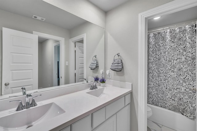 2104 Devonblue Dr, Forney, TX 75126 - bathroom featuring double vanity, toilet, marble finish floors, and shower / tub combo with curtain