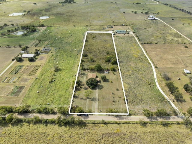 birds eye view of property featuring a rural view