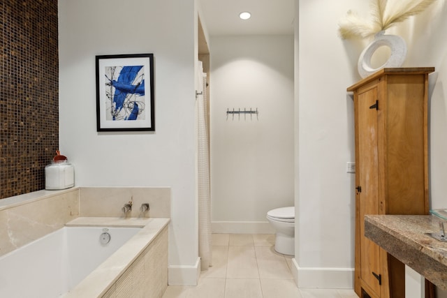 bathroom with toilet, tile patterned flooring, and a bath