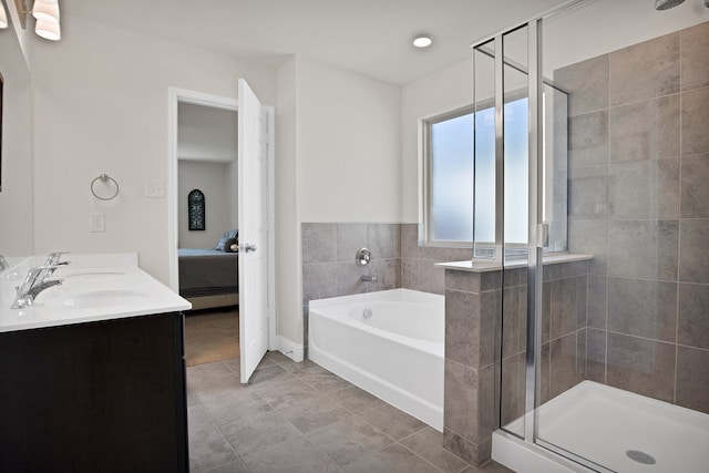 bathroom with separate shower and tub, tile patterned flooring, and sink