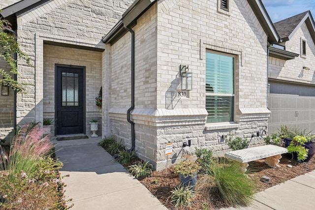 entrance to property featuring a garage