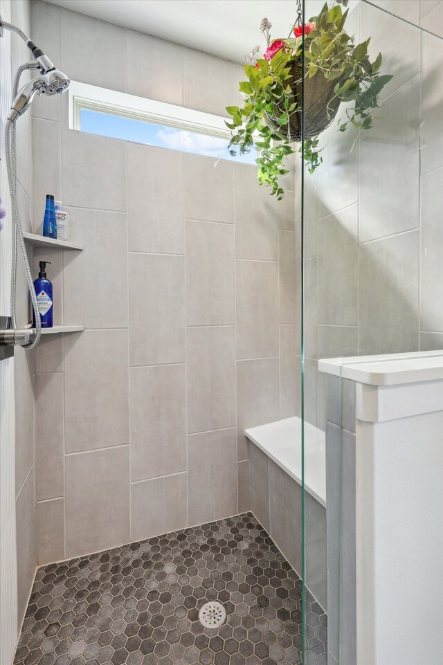 bathroom with a tile shower