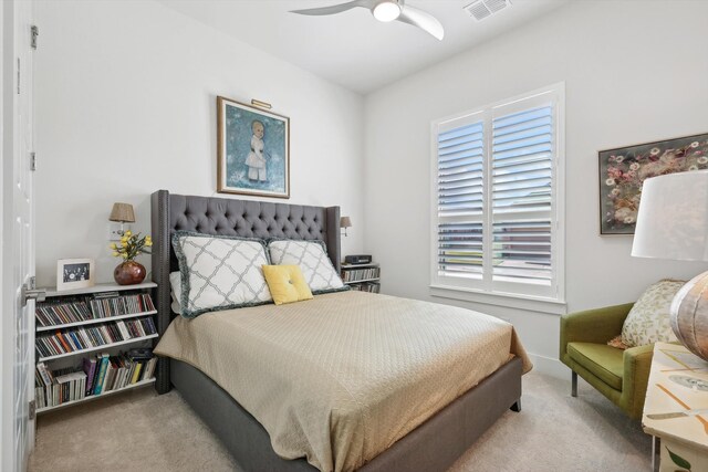 bedroom featuring ceiling fan and light colored carpet