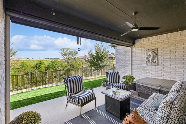 view of patio featuring outdoor lounge area and ceiling fan