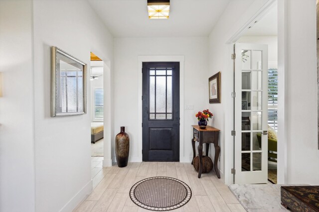 entryway with light hardwood / wood-style floors