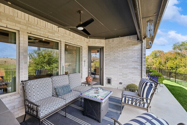 view of patio with ceiling fan and an outdoor living space