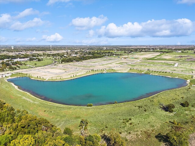 birds eye view of property with a rural view and a water view