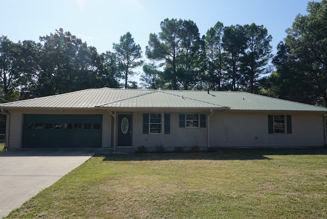 single story home featuring a garage and a front yard