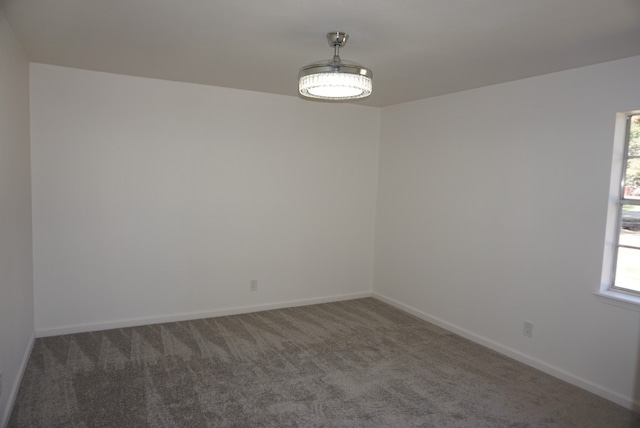 empty room with dark carpet