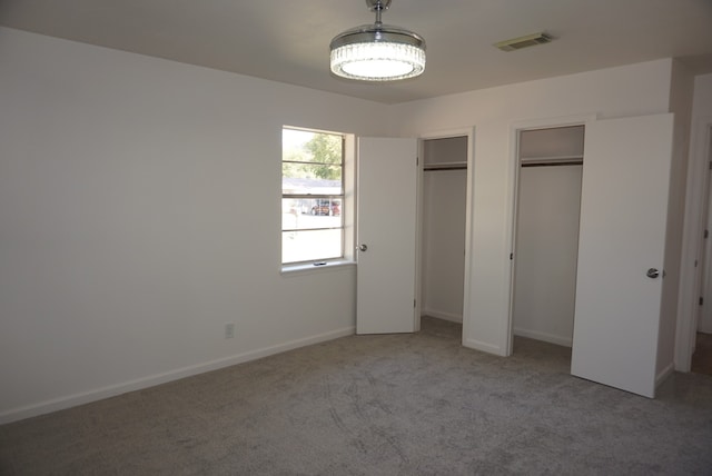 unfurnished bedroom featuring carpet