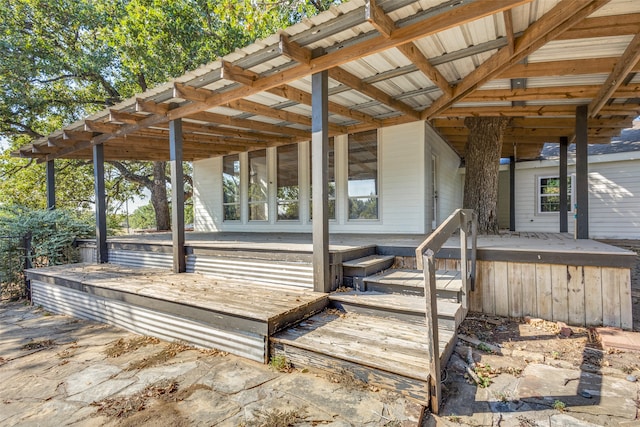 wooden terrace featuring a patio area