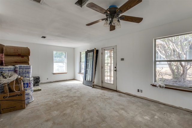 unfurnished living room with ceiling fan