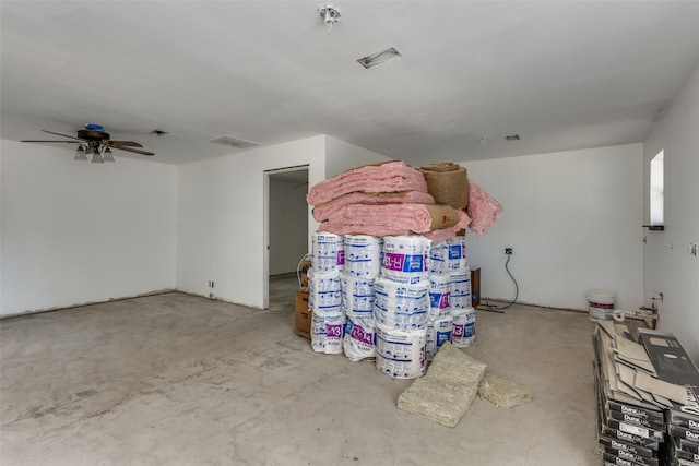 interior space with ceiling fan and concrete flooring