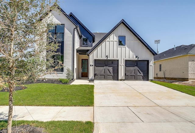 modern inspired farmhouse with a front lawn