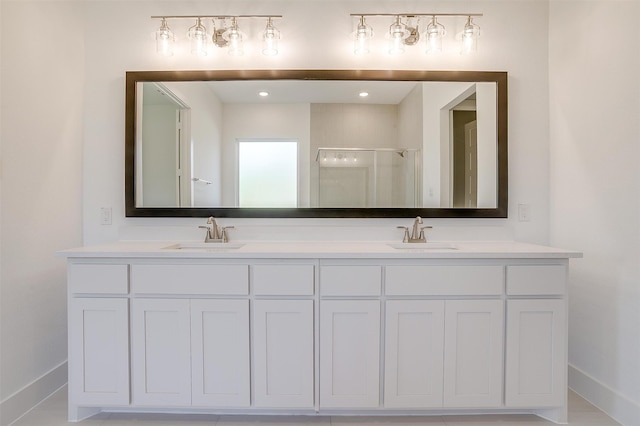 bathroom with tile patterned floors, vanity, and an enclosed shower