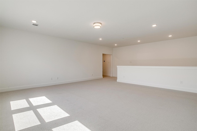 spare room with light colored carpet