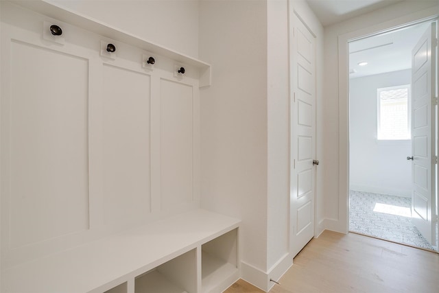 mudroom with light hardwood / wood-style flooring