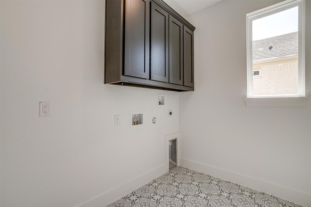 laundry room with hookup for an electric dryer, hookup for a washing machine, cabinets, and hookup for a gas dryer