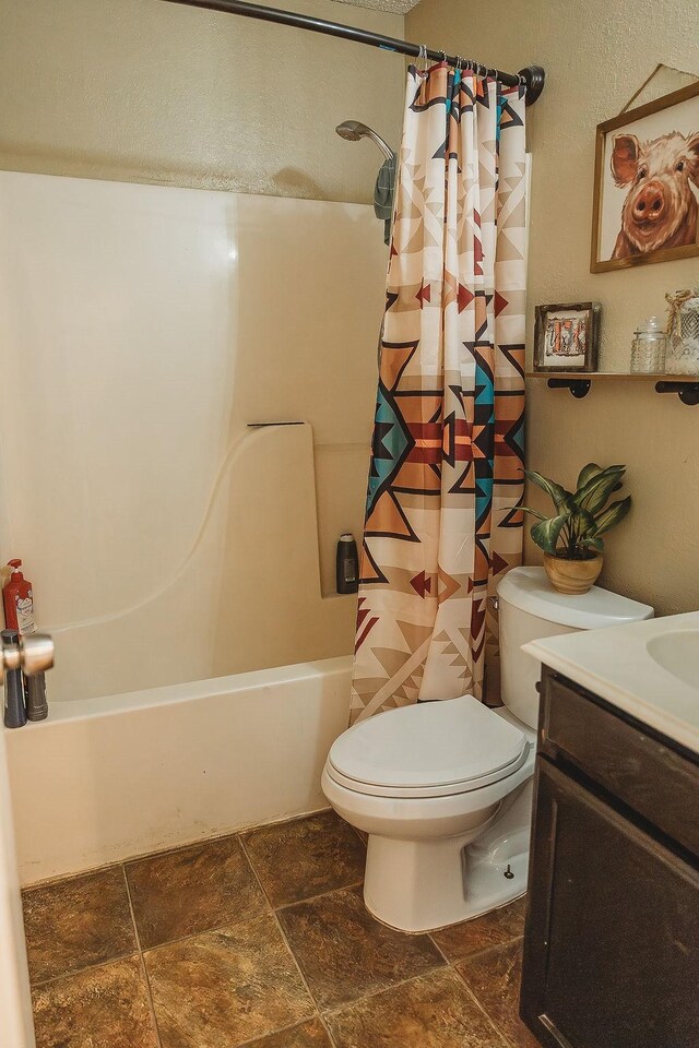 full bathroom with toilet, a textured ceiling, shower / bath combo, and vanity