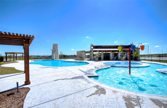 view of pool featuring a patio, a pergola, a hot tub, and pool water feature